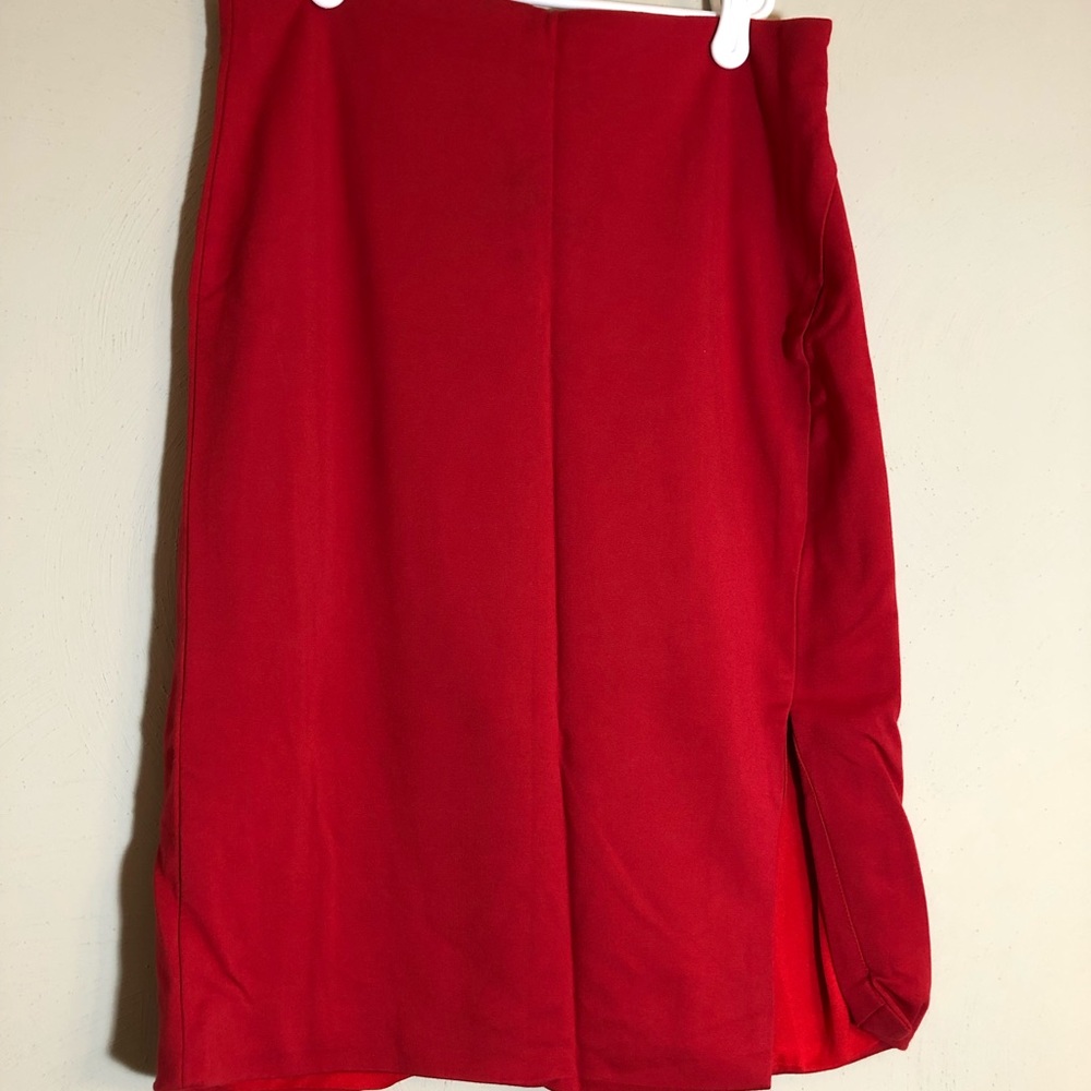 Red pencil skirt with slit.